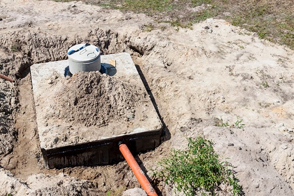 signs that your septic tank needs pumping include slow drains, foul odors, and pooling water in the yard